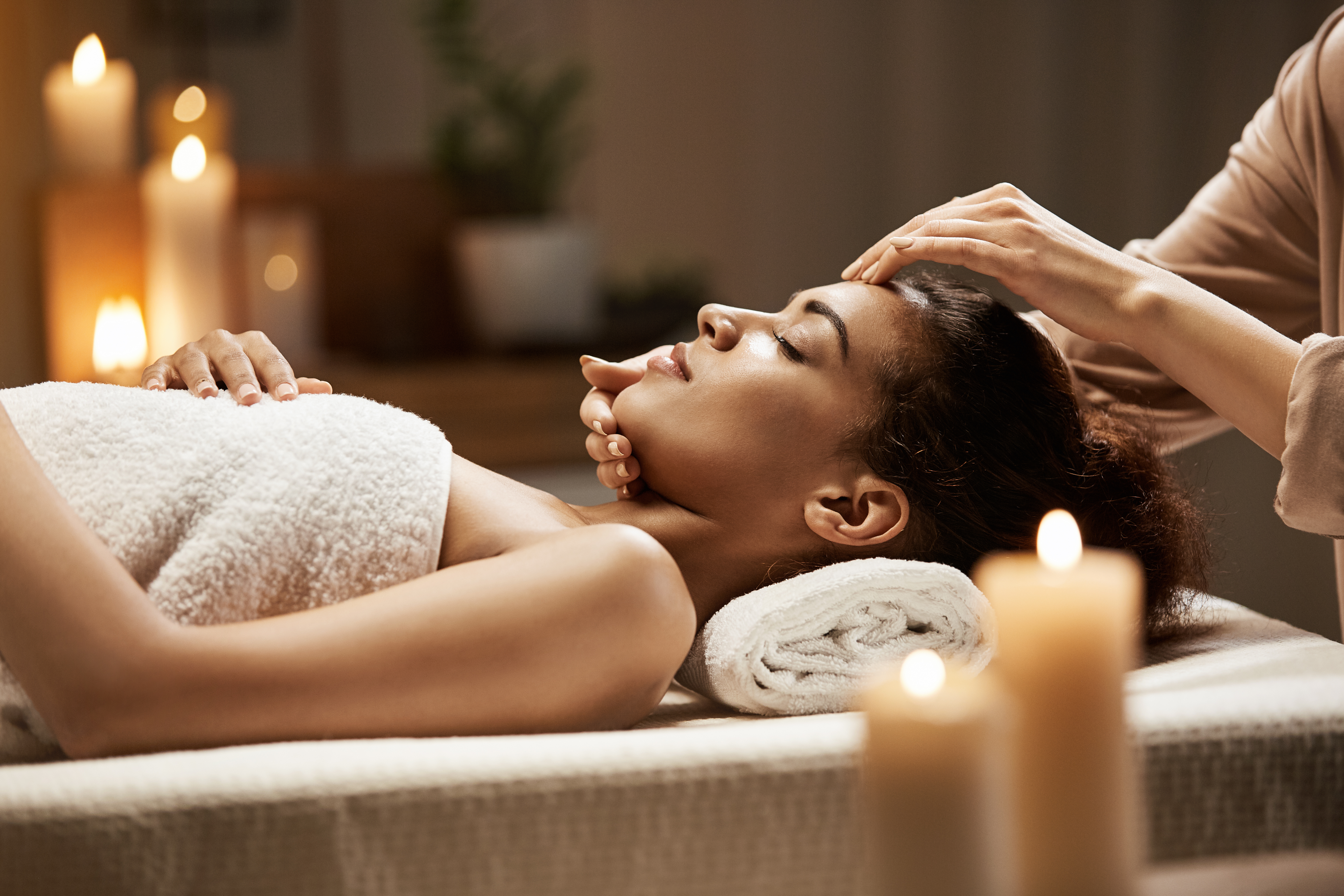 Woman Lying on Table Receiving a Spa Facial
