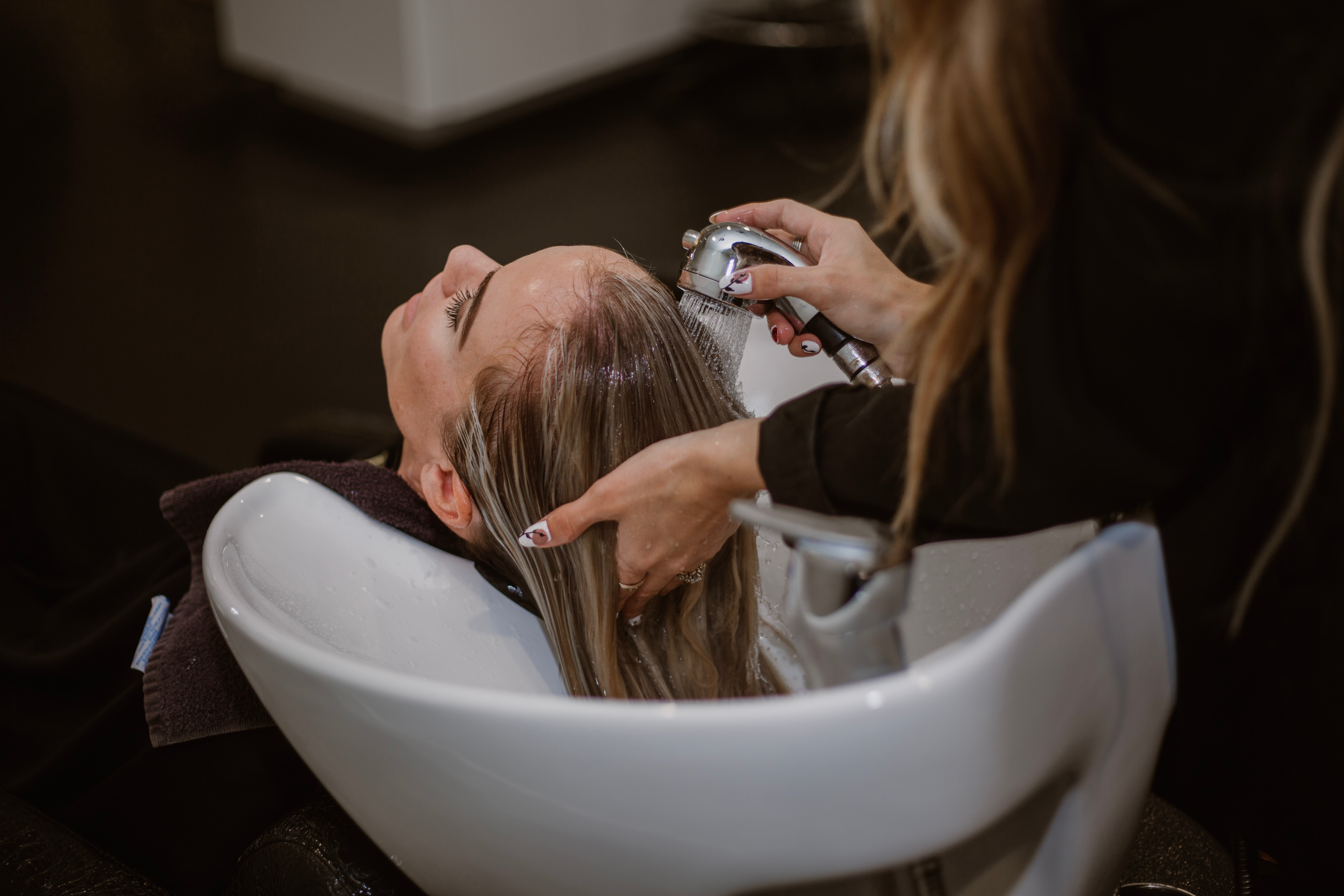 Hair Styist Shampooing Client